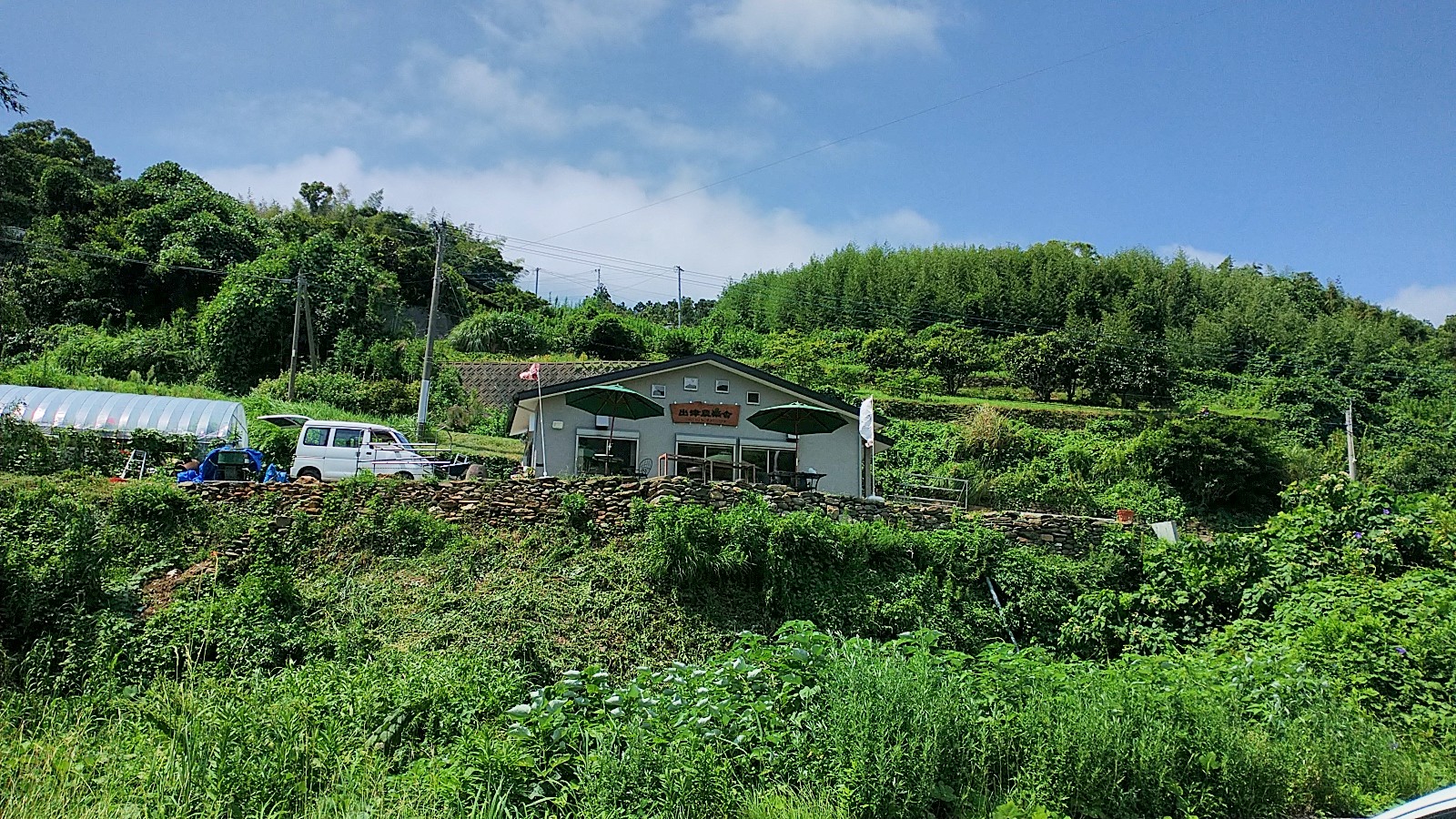 The exterior of a cafe in a rural area on a nice clear day